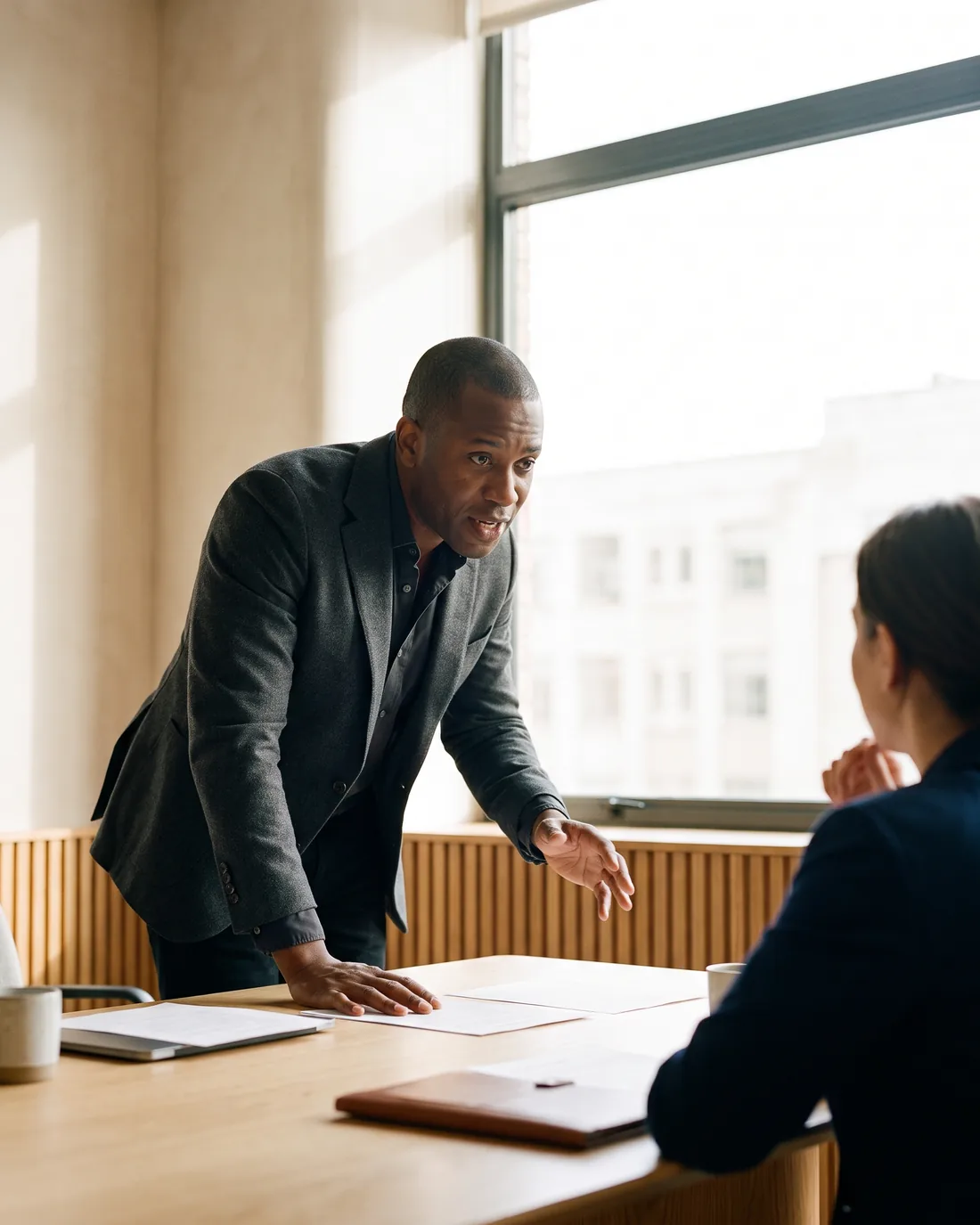 A senior CFO reviewing the work in a calm Johannesburg boardroom